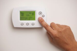 setting the temperature on a thermostat
